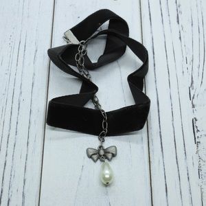 Pear Drop pendant with a black velvet ribbon band necklace.